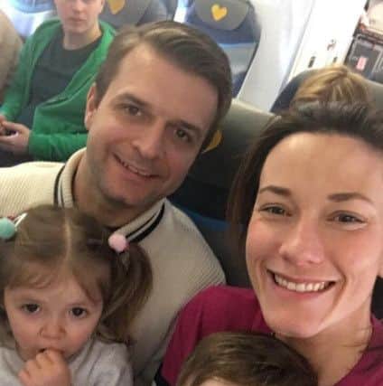 Charlie Burrell with his partner Laura and their two children